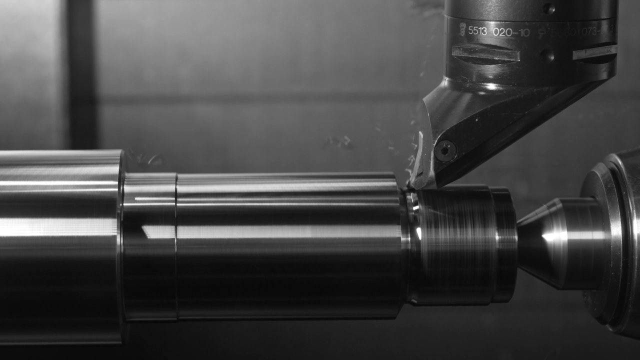 Silent looping clip of a steel part being turned on a CNC machine.